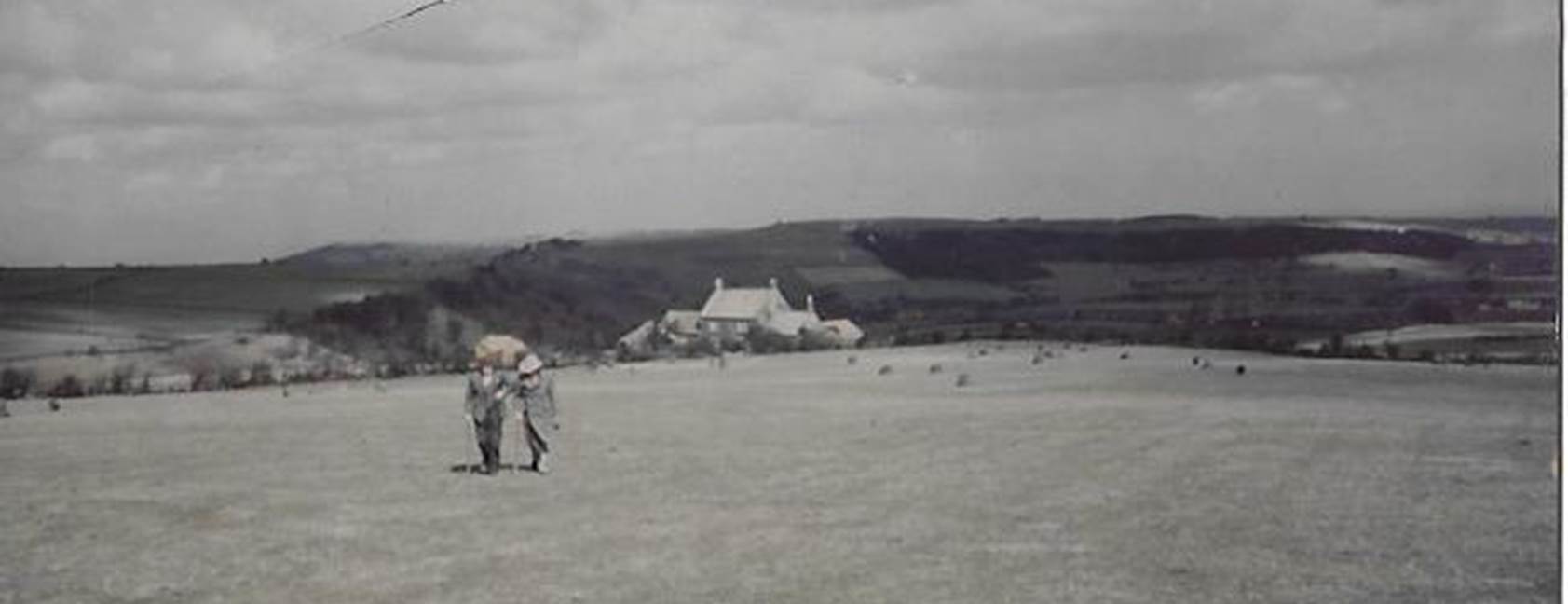 A group of people standing on top of a sandy beach
Description automatically generated